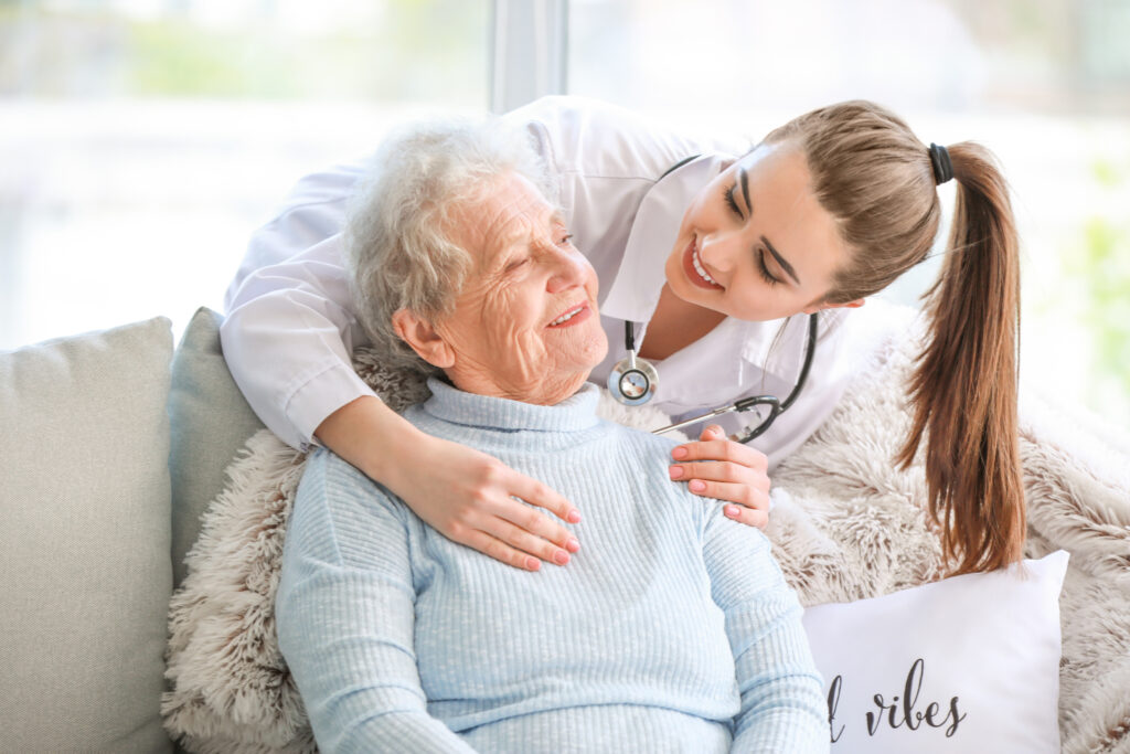 Doctor with senior woman in nursing home